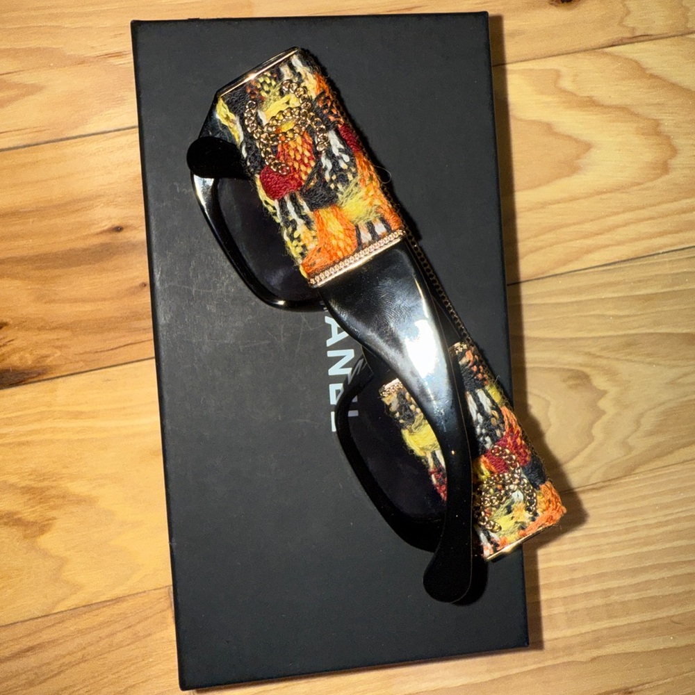 CHANEL Black and Orange Sunglasses with Artistic Design
